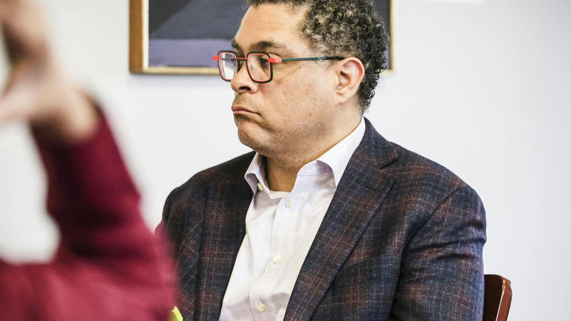 Cornell vice president Kyle Kimball sits at a meeting.