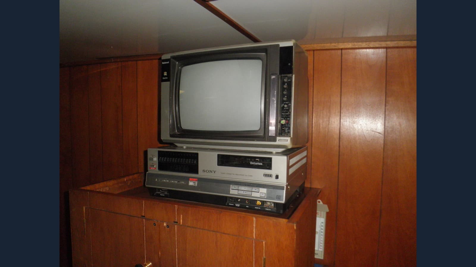 A Sony Betamax videocassette recorder beneath a television.