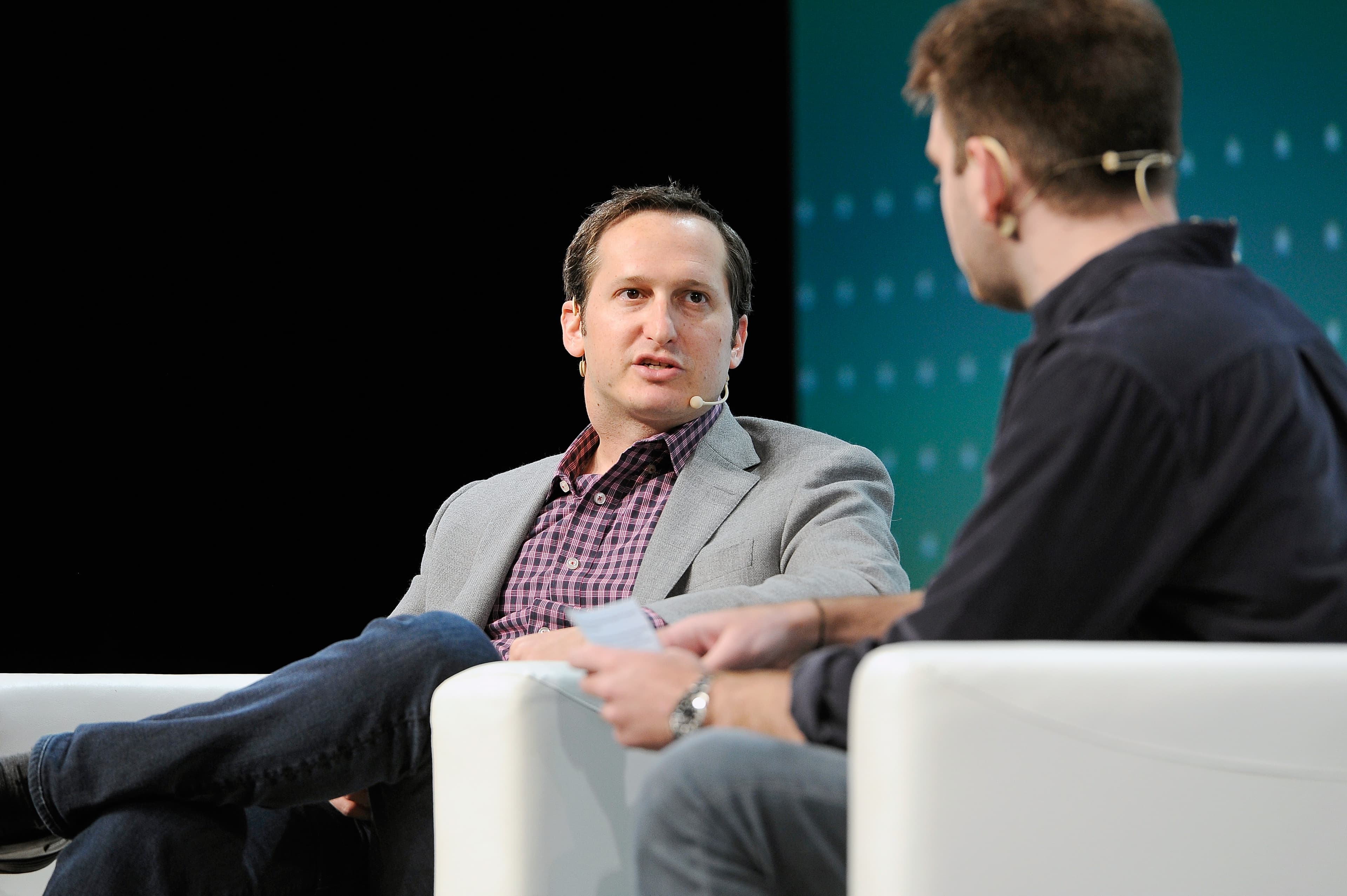 Jason Robins, left, speaking with Fitz Tepper at TechCrunch Disrupt in 2018.