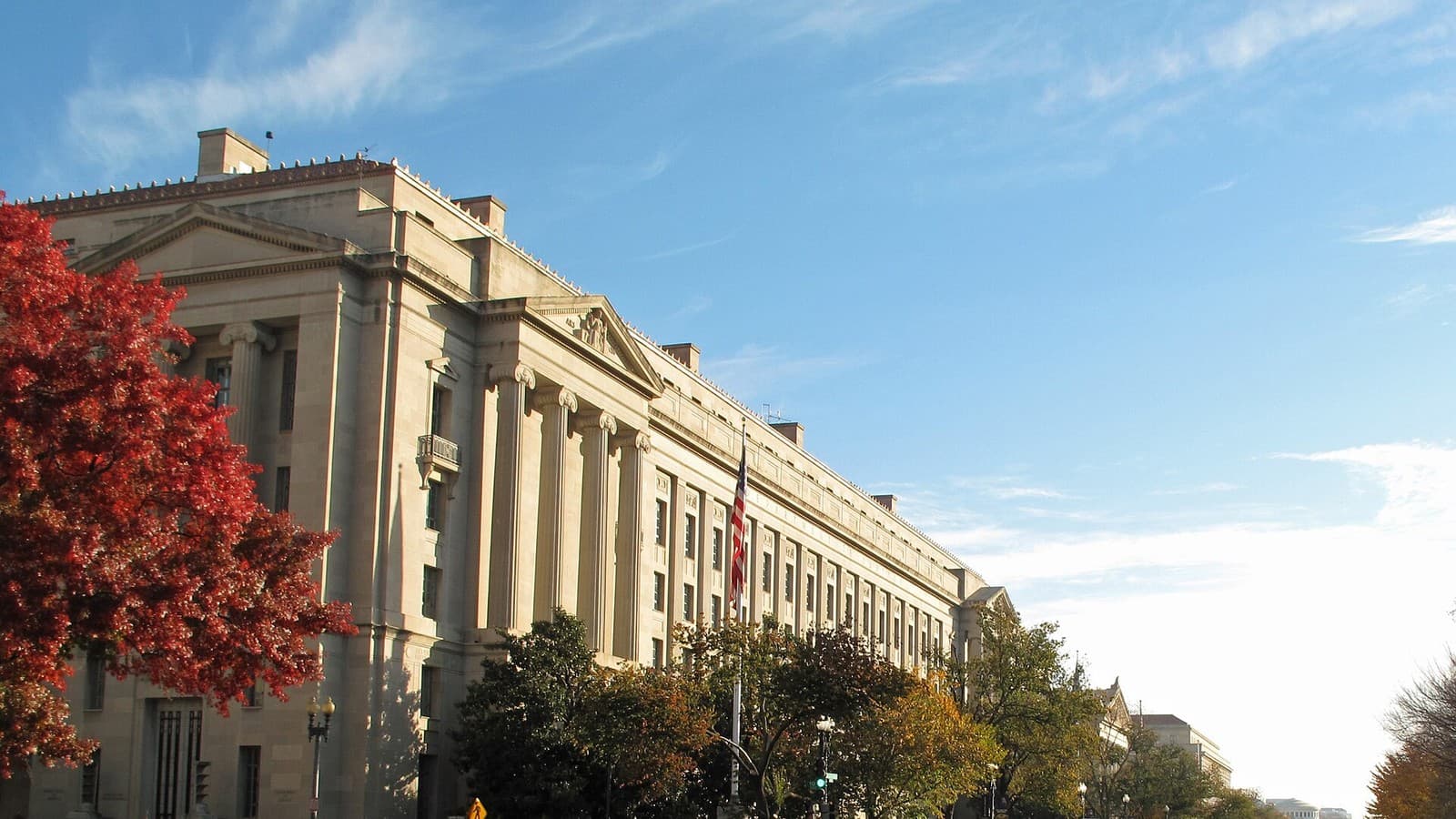 The Robert F. Kennedy Department of Justice Building beside a Washington street.