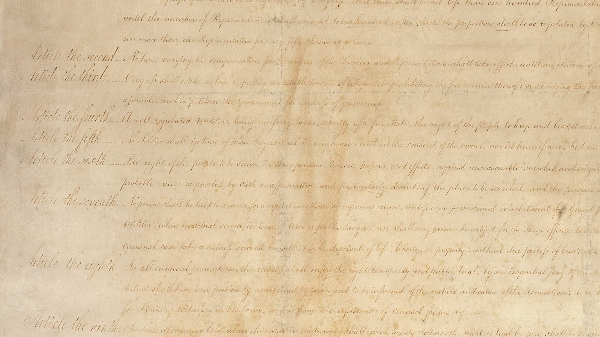 Handwritten text of the Bill of Rights as proposed by Congress in 1789, with the margin labels "Article the second" through "Article the ninth"; "Article the sixth" begins "The right of the people to be secure in their persons, houses, papers and effects."