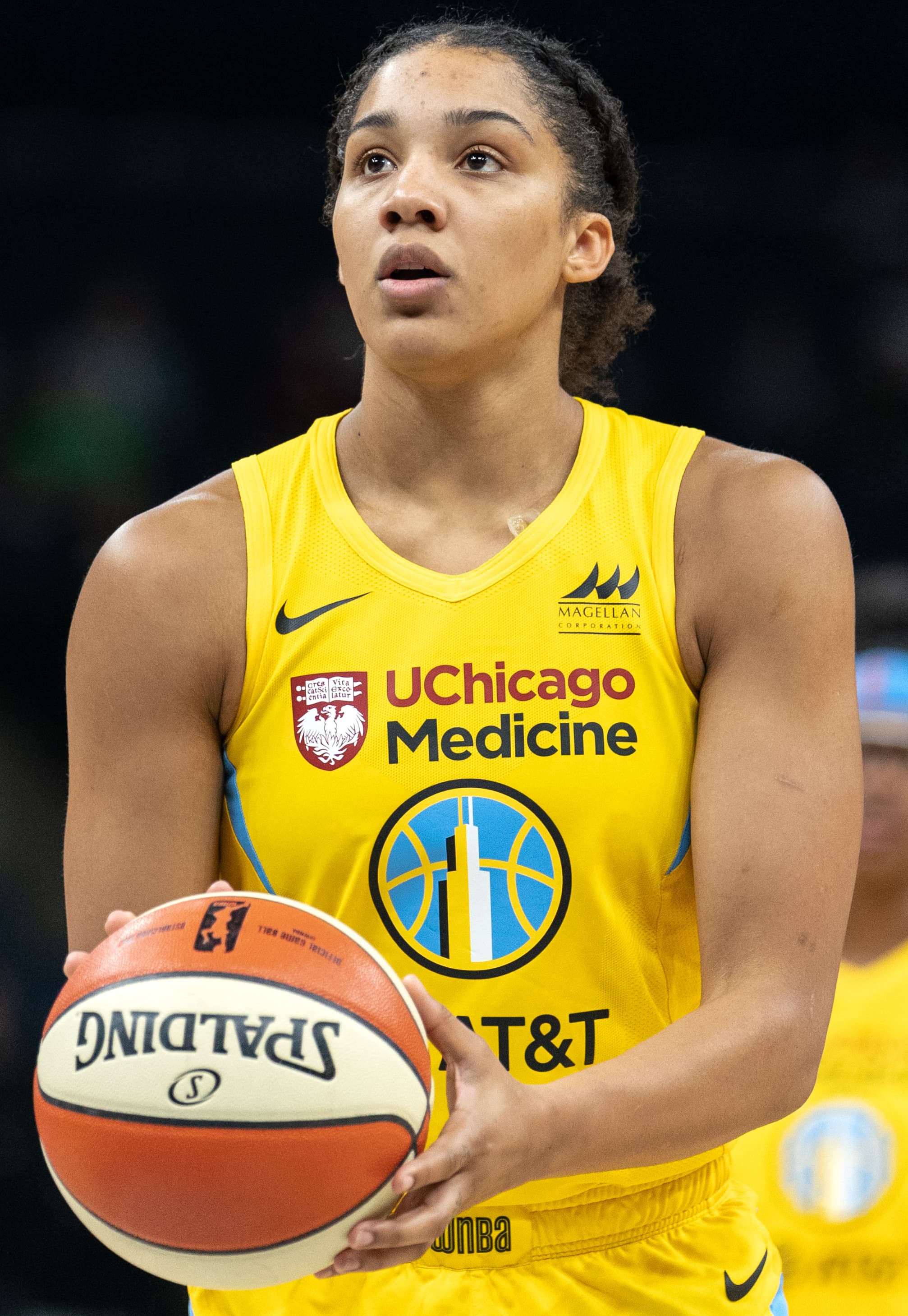 Gabby Williams holding a basketball in a Chicago Sky uniform in 2019.