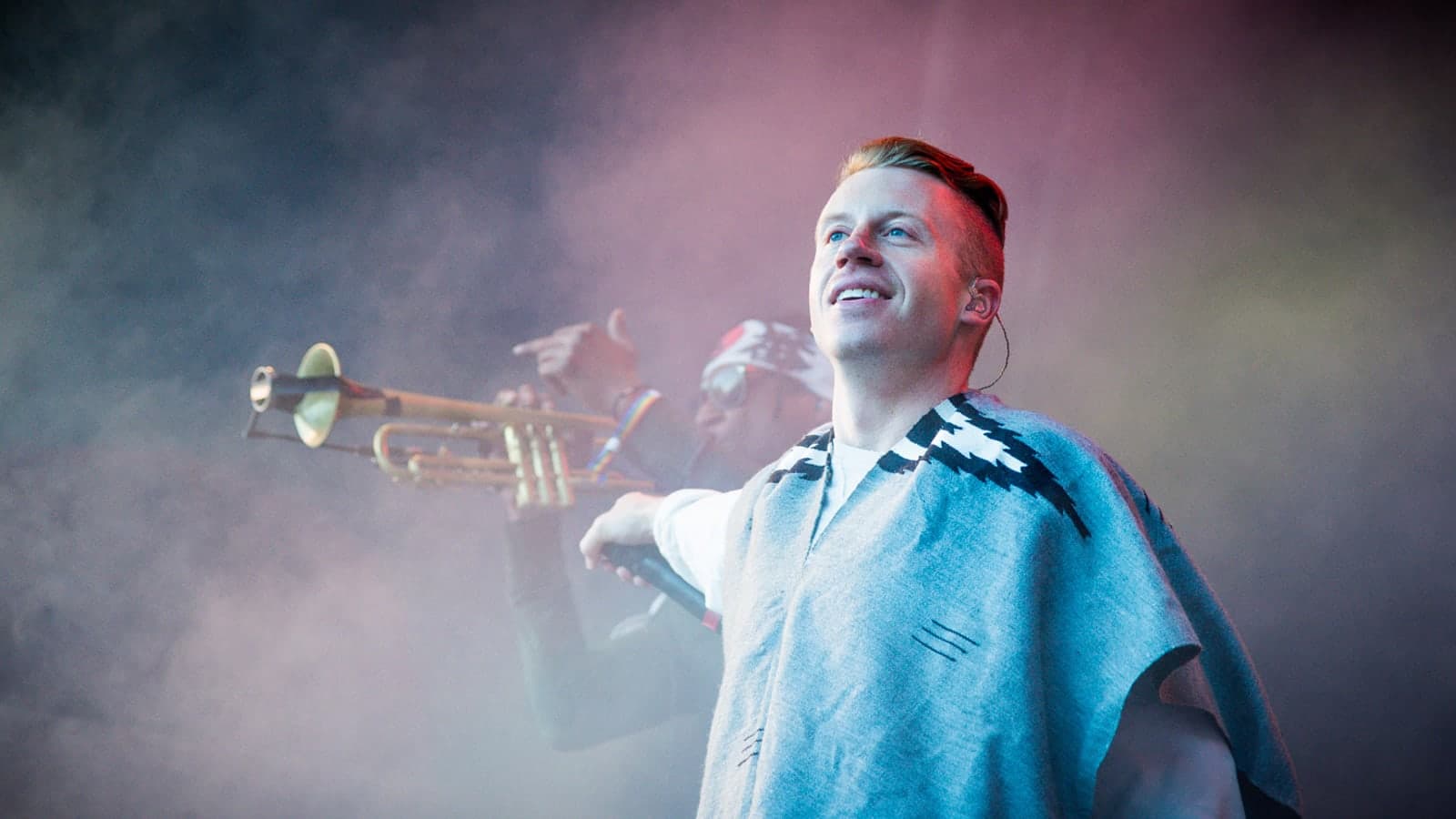 Macklemore performing onstage at Hovefestivalen in 2013