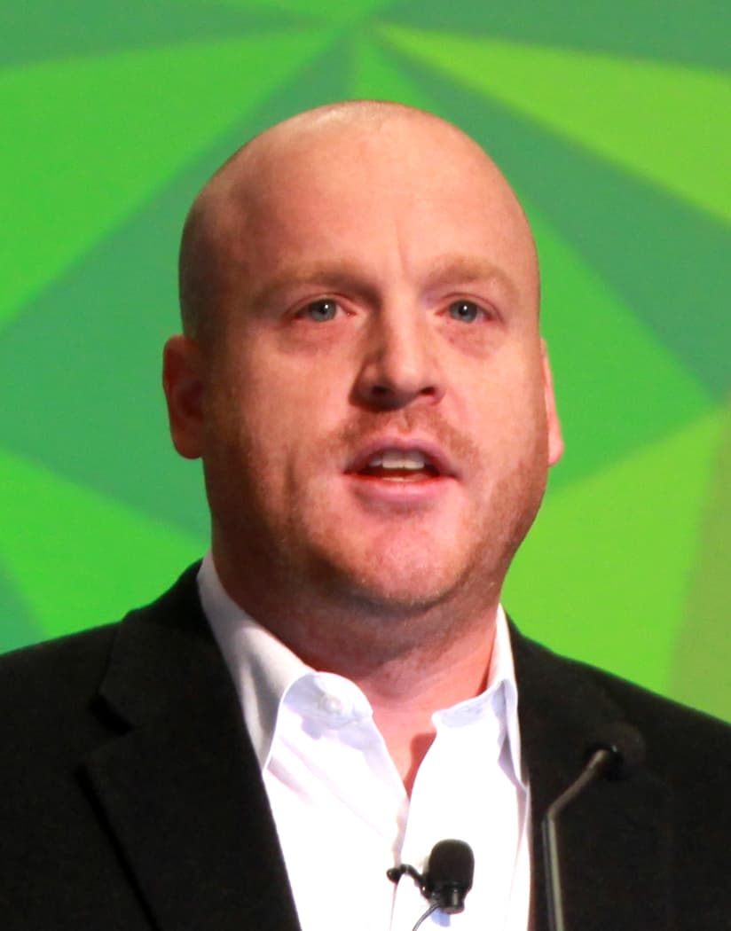 Radley Balko speaking at a lectern in 2014