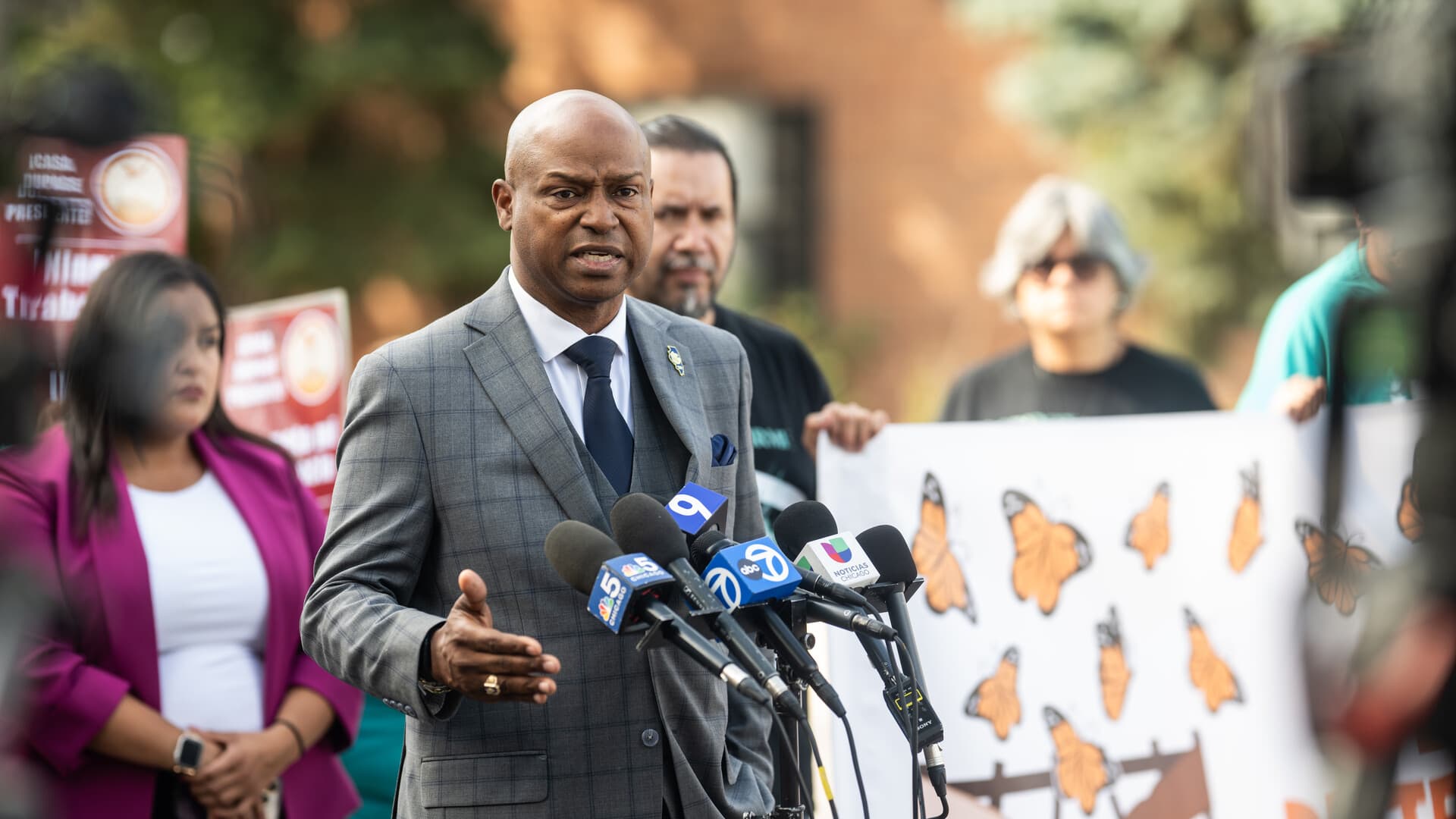 Speakers and community members at a press conference at the Franklin Park site where an ICE agent killed Silverio Villegas González.