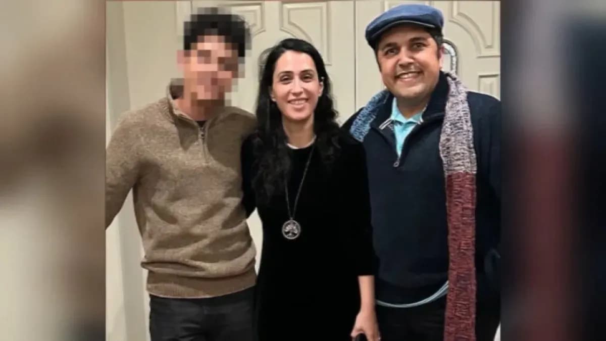 Maryam Tahmasebi and Seyed Eissa Hashemi with their son’s face blurred