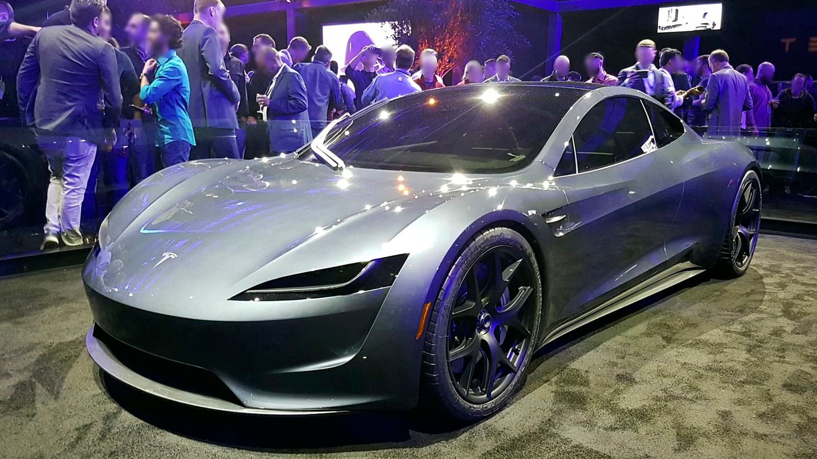 A silver Tesla Roadster prototype displayed at its 2017 launch event.
