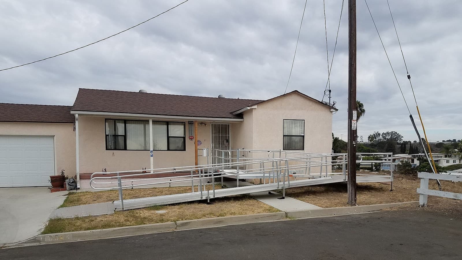 An accessibility ramp leading to the front door of a house.