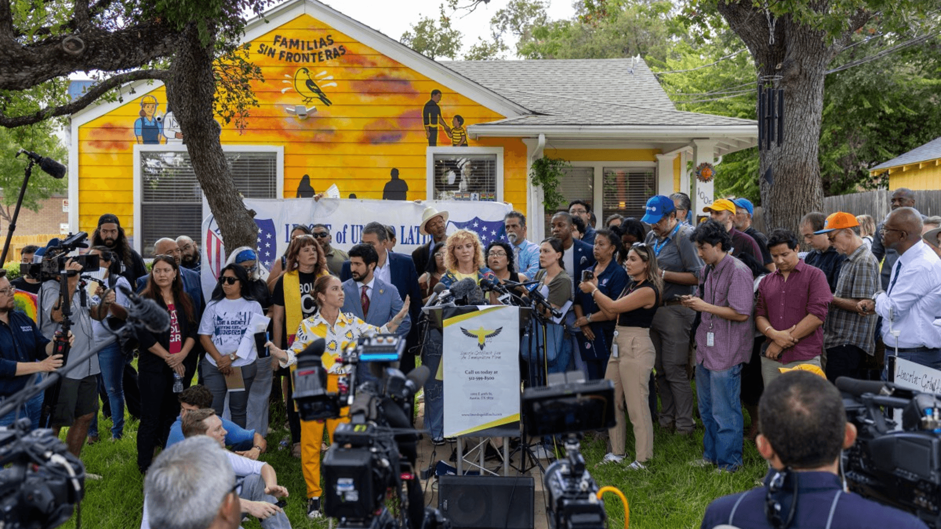 Reporters and advocates gather at the Austin press conference where Wilber Rafael Garces Perez spoke by phone from ICE detention.