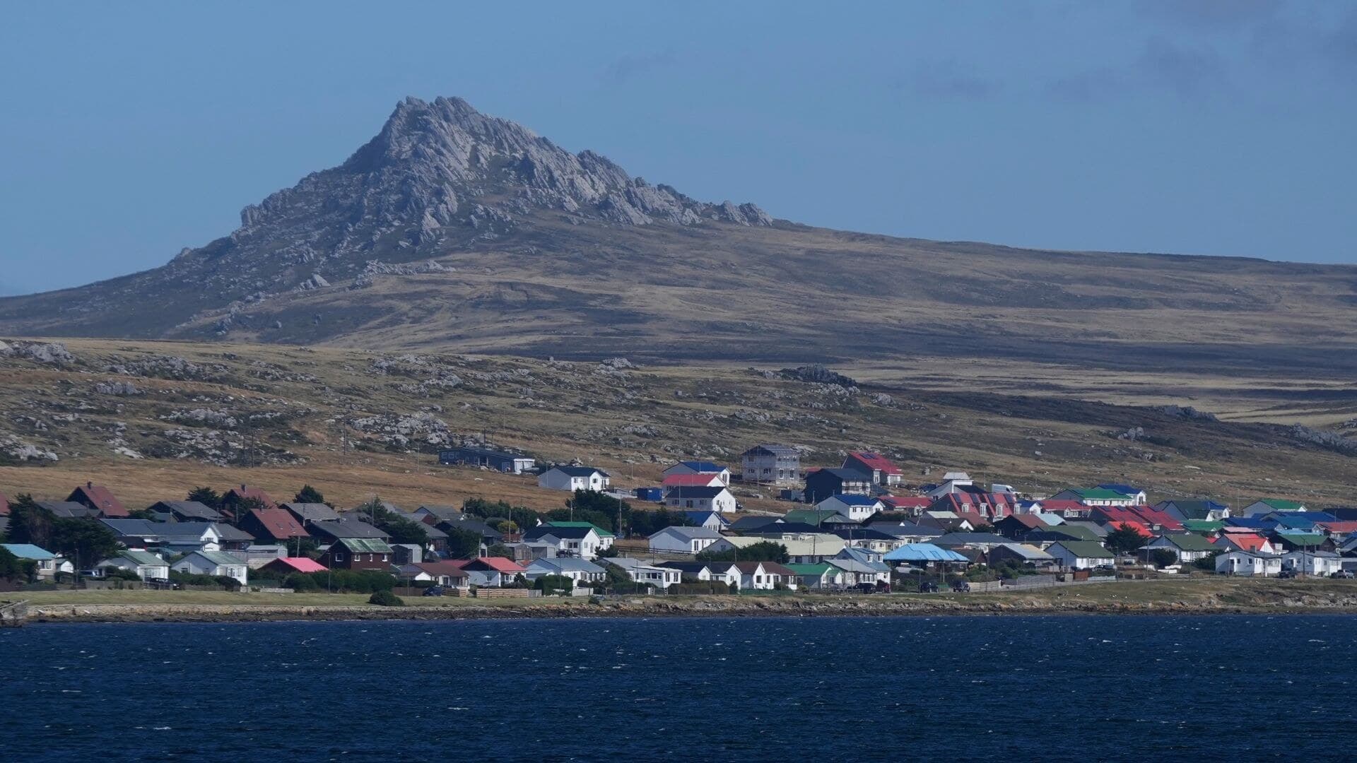 Mount Tumbledown rises behind Stanley in the Falkland Islands.