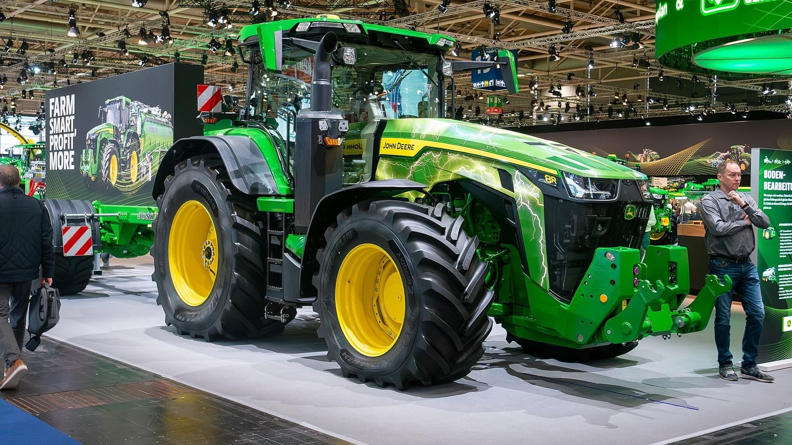 A green John Deere 8R tractor at the Agritechnica trade show.