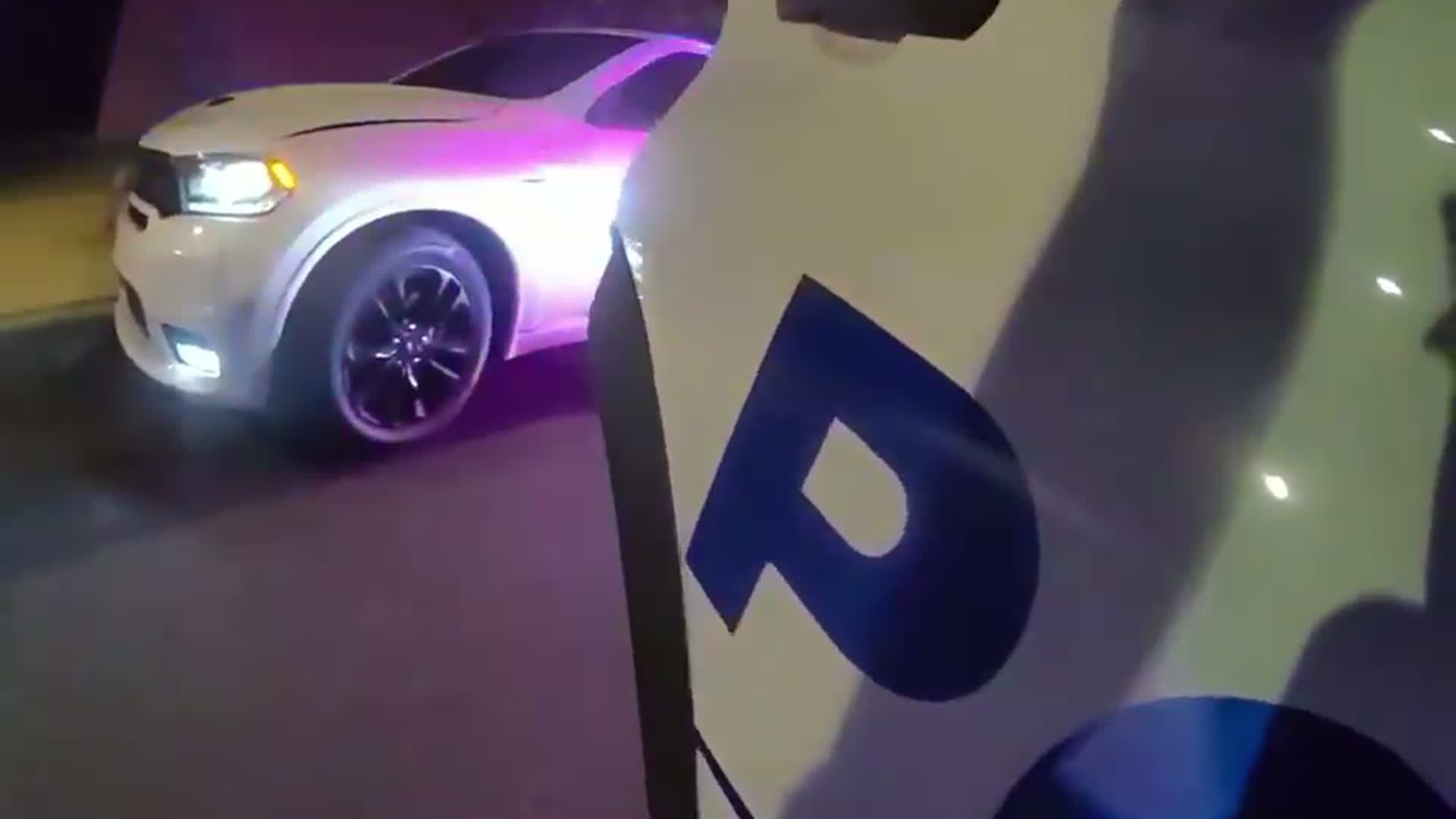 D.C. police body-camera footage showing patrol vehicles and emergency lights during the traffic stop involving Phillip Brown.