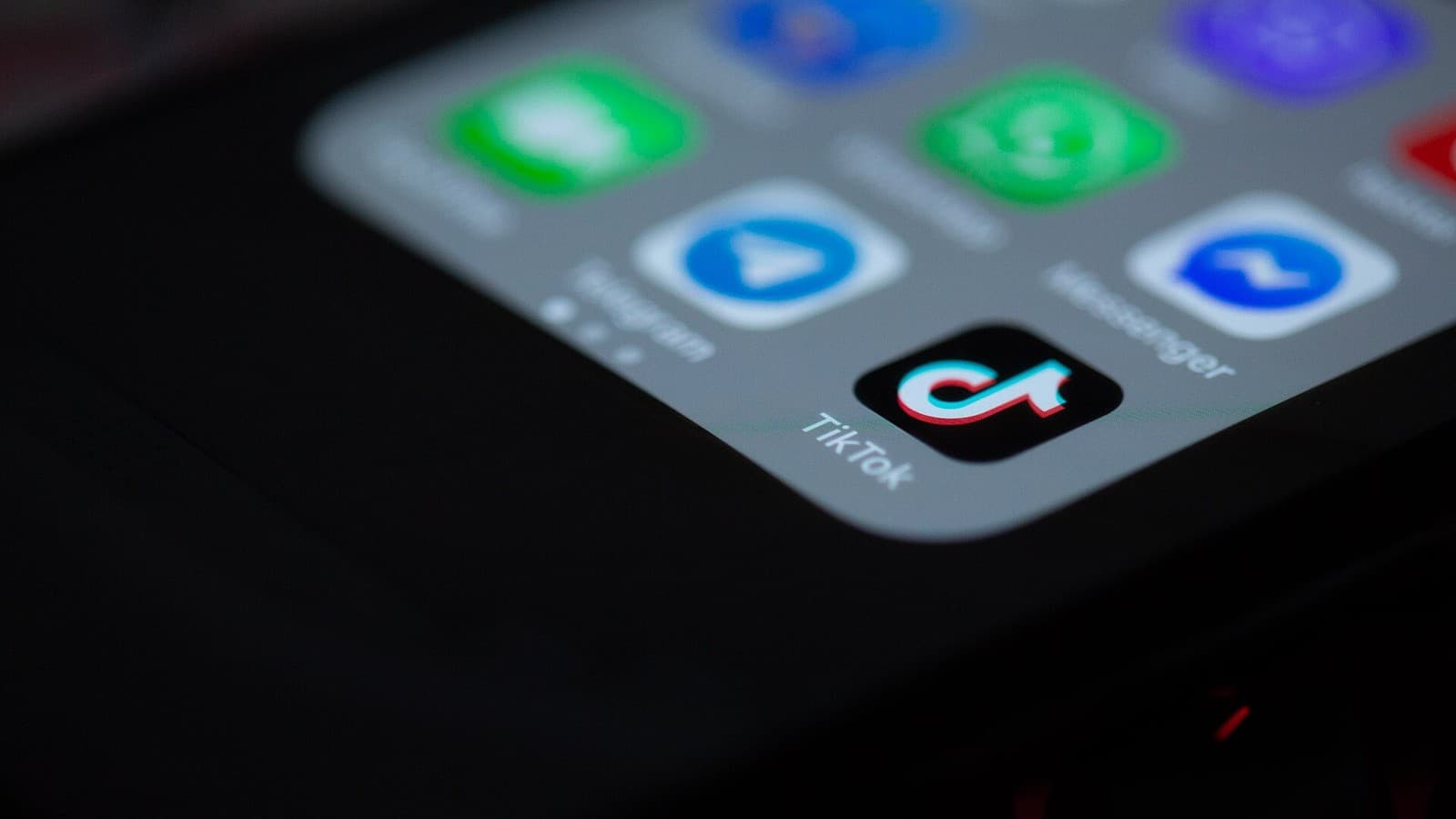 The TikTok app icon on a mobile phone screen.